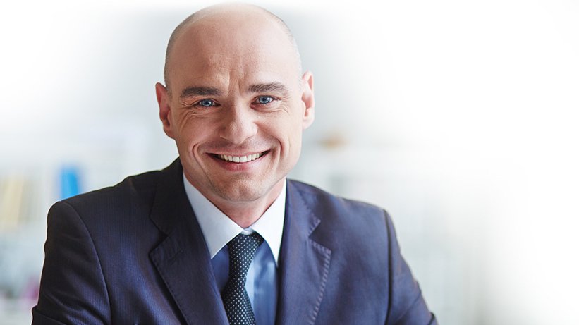 Young male insurance worker smiling