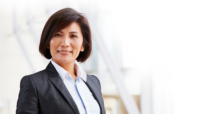 Brown-haired female insurance worker smiling