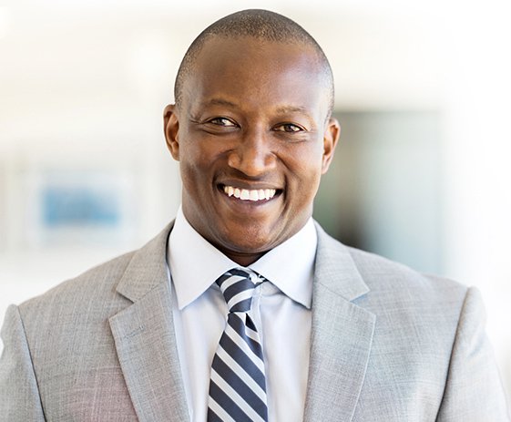 Young male insurance worker smiling